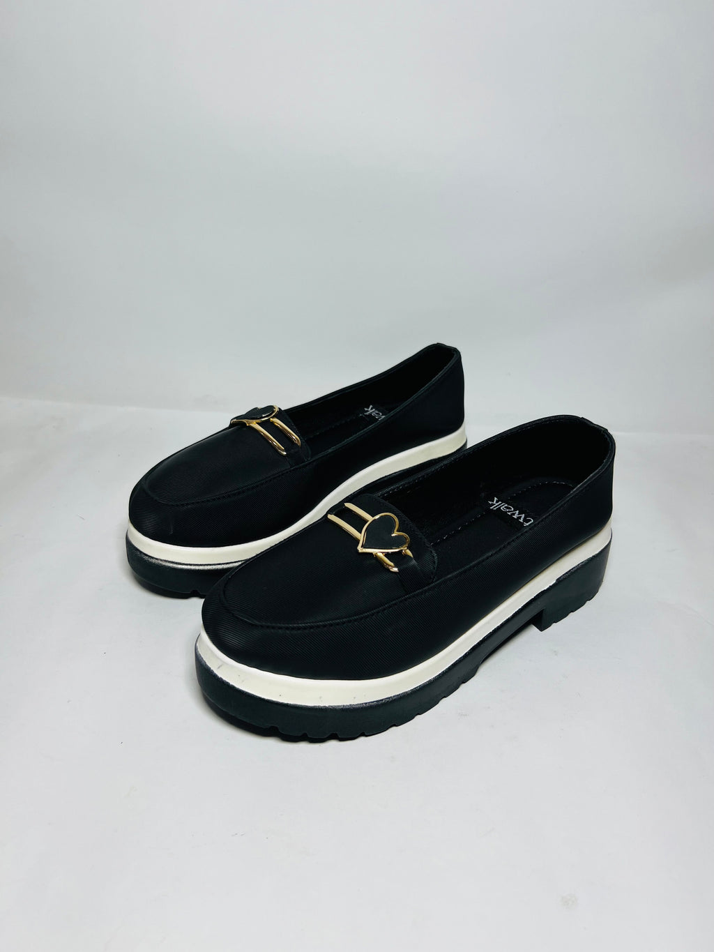 Chunky Sole Loafers: Black Elegance with Modern Hardware.